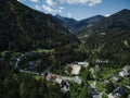 Beautiful view from a drone of a village with curly road surrounded by mountains in Slovenia