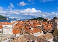 Beautiful view of Dubrovnik old city rooftops, sea and sky with white clouds Royalty Free Stock Photo