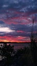 Beautiful view of dusk with red clouds over the calm sea Royalty Free Stock Photo