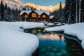 Beautiful view of Emerald Lake with snow covered and wooden lodge glowing in rocky mountains and pine forest on winter Royalty Free Stock Photo