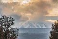 A beautiful view of the eruption of volcano Etna with smoke and snow is in the photo in winter in Sicily Royalty Free Stock Photo