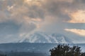 A beautiful view of the eruption of volcano Etna with smoke and snow is in the photo in winter in Sicily Royalty Free Stock Photo