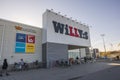 Beautiful view of facade of Willy:s supermarket with people visiting supermarket.