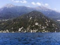 Beautiful view of the famous Como Lake on sunny summer day of the lake with Alp mountains on the background. Royalty Free Stock Photo