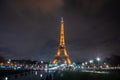 Beautiful view of the famous Eiffel Tower in Paris at night.