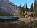Beautiful view of famous Emerald Lake in Yoho National Park, Rocky Mountains with wooden building reflected in the calm water. Royalty Free Stock Photo