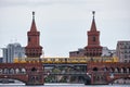 Beautiful view of famous Oberbaum Bridge crossing the Spree river with yellow train Royalty Free Stock Photo