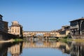 A Beautiful view of the famous Old Bridge & x28;Ponte Vecchio& x29; and Uffizi Gallery with blue sky in Florence as seen from Arno Royalty Free Stock Photo