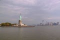 Beautiful view of famous Statue of Liberty and Manhattan on background.