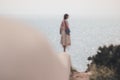 Beautiful view of a female standing near the oceab Royalty Free Stock Photo