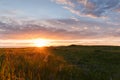Beautiful view of the field and sunset. Beautiful nature landscape with dramatic clouds sunset sky and views on the hills Royalty Free Stock Photo