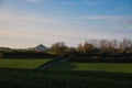 Beautiful view of a field and trees in the background in Plancenoit, Belgium