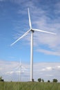 View of field with wind turbines. Alternative energy source Royalty Free Stock Photo