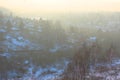 A beautiful view of the filling of the winter morning fog on the landscape of houses. Landscapes top view at sunset in