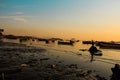 Beautiful view of fishing boats in the sea near coast at sunset Royalty Free Stock Photo
