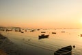 Beautiful view of fishing boats in the sea near coast at sunset Royalty Free Stock Photo