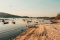 Beautiful view of fishing boats in the sea near a sandy shore Royalty Free Stock Photo