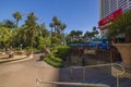 Beautiful view of Flamingo casino hotel territory with park and open-air restaurant on backdrop of Ferris wheel. Las Vegas.