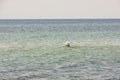 Beautiful view of floating woman in calm turquoise waters of Mediterranean sea. Royalty Free Stock Photo