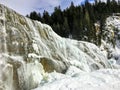A beautiful view of a frozen waterfall at Wapta Falls in the Rocky Mountains in the background, in Yoho National Park Royalty Free Stock Photo