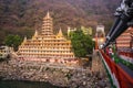 Beautiful view of Ganga river embankment, Lakshman Jhula bridge and Tera Manzil Temple, Trimbakeshwar in Rishikesh, India Royalty Free Stock Photo