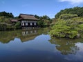 Beautiful view of a garden with a house near a lake in Heian, Shrine, Kyoto, Japan Royalty Free Stock Photo