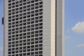 Beautiful view of geometric urban landscape of hotel building block with elevator lift outside and blue sky in central business di