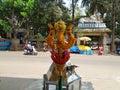 Beautiful view of Goddess Face in the Yellow Color Trishula or Trident in front of the Sri Gangamma Devi Temple Near Kadu