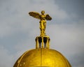 Beautiful view of a golden statue of an angel with wings at the entrance of a hotel in Alanya