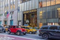 Beautiful view of the grand entrance of Trump Tower in New York City, framed by bustling street traffic.