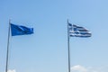 Beautiful view of Greece and Europe flags on blue sky background. Royalty Free Stock Photo