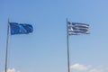 Beautiful view of Greece and Europe flags on blue sky background. Royalty Free Stock Photo