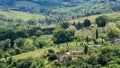 Beautiful view of green fields and meadows at sunset in Tuscany Royalty Free Stock Photo