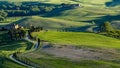 Beautiful view of green fields and meadows at sunset in Tuscany Royalty Free Stock Photo