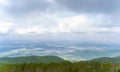 beautiful view from the green hill with a small town downhill. Ushkonyr plateau, Almaty, Kazakhstan. Royalty Free Stock Photo