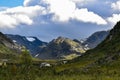 Beautiful view of a green mountainous landscape under a cloudy sky Royalty Free Stock Photo