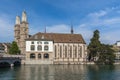 Beautiful view of Grossmuenster Grossmunster church and Wasserkirche Water Church in sunshine from opposite side of Limmat