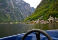 Beautiful View of the Hallstatt from lake Hallstater See, Austria with blue boat on the front popular tourist location Royalty Free Stock Photo