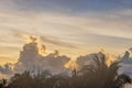 Beautiful view of hazy blue sky with white clouds during sunrise over Atlantic Ocean with palm trees in background. Miami Beach. Royalty Free Stock Photo
