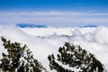 Beautiful view from high above the clouds towards the summit of Mt San Gorgonio and Mt San Jacinto, visible in the background;