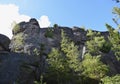 Beautiful view of the high, ancient rocks in the forest.