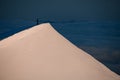 beautiful view of high snow covered mountain slope with man on top. Royalty Free Stock Photo