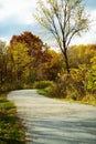 Beautiful view of a highway with fall foliage trees around Royalty Free Stock Photo