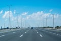 A beautiful view of higway in Abu dhabi with blue cloudy sky
