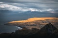 Beautiful view of hills over a lake under a great natural view of a cloudy sky