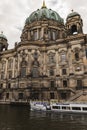 Beautiful view of historic Berlin Cathedral Berliner Dom at famous Museumsinsel Museum Island with excursion boat on Spree riv