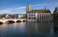 Beautiful view of historic city center of Zurich with famous Fraumunster Church and Munsterbucke crossing river Limmat Royalty Free Stock Photo