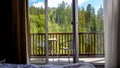 Beautiful view from the hotel room on balcony and table served for breakfast against beautiful forest and mountains Royalty Free Stock Photo