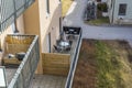 Beautiful view of house on interior of facade of building with patio on ground floor of modern apartments. Royalty Free Stock Photo