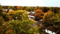 Beautiful view of the houses surrounded by colorful autumn trees. Wyoming, Michigan, US.